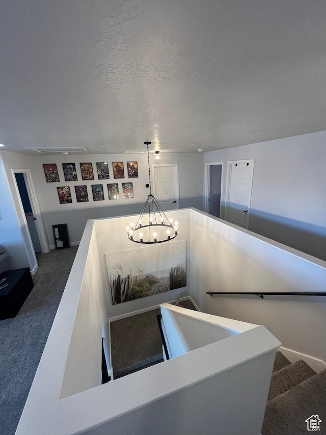 2323 W Thomas Ct, Syracuse, UT 84075 - stairs with a chandelier and carpet flooring
