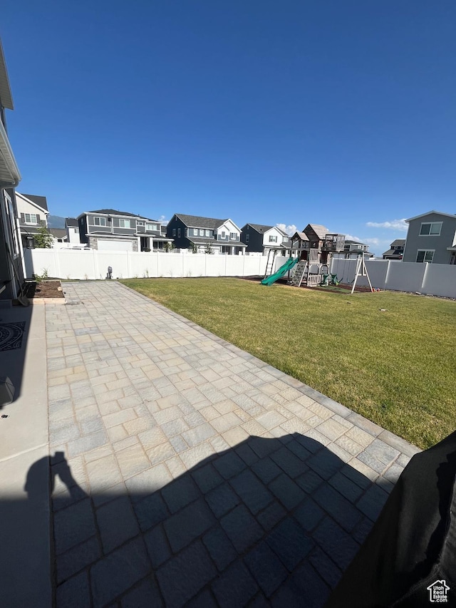 2323 W Thomas Ct, Syracuse, UT 84075 - view of patio / terrace with a playground and a residential view