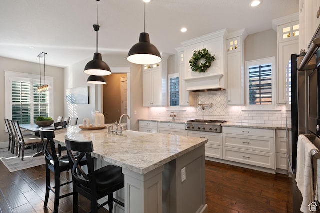 4492 W Enid Dr, South Jordan, UT 84009 - kitchen with a sink, stainless steel gas stovetop, backsplash, dark wood-style floors, and white cabinetry