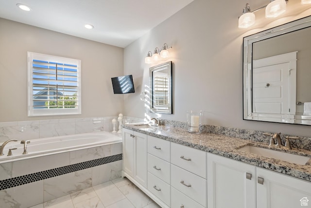 4492 W Enid Dr, South Jordan, UT 84009 - bathroom featuring marble finish floors, double vanity, a garden tub, and recessed lighting