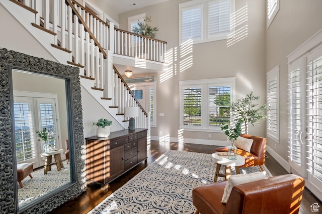 4492 W Enid Dr, South Jordan, UT 84009 - living room with a towering ceiling, dark wood-type flooring, healthy amount of natural light, and baseboards