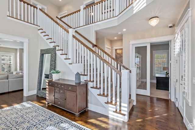 4492 W Enid Dr, South Jordan, UT 84009 - foyer with a high ceiling, dark wood-style flooring, baseboards, stairs, and recessed lighting