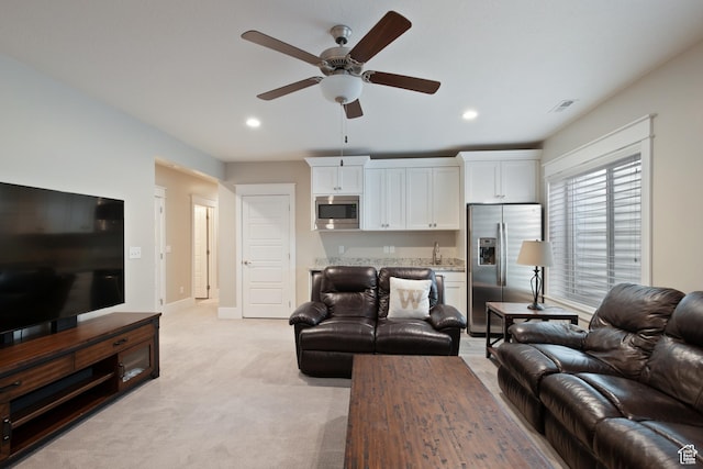 4492 W Enid Dr, South Jordan, UT 84009 - living area featuring ceiling fan, recessed lighting, light colored carpet, and baseboards