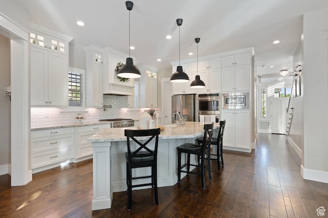 4492 W Enid Dr, South Jordan, UT 84009 - kitchen with stainless steel appliances, white cabinetry, tasteful backsplash, dark wood finished floors, and recessed lighting