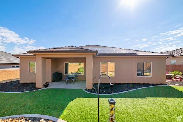 478 S Albano Way, St George, UT 84770 - back of property with a patio area, solar panels, stucco siding, and a tile roof