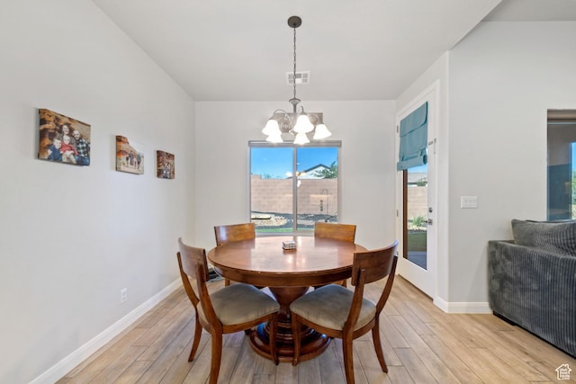 478 S Albano Way, St George, UT 84770 - dining area featuring a chandelier, light wood-style floors, and baseboards