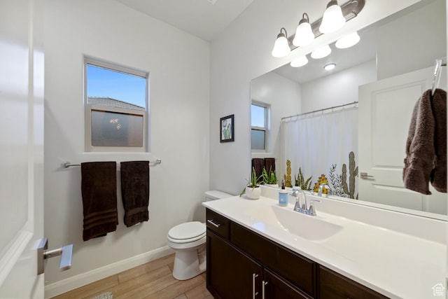 478 S Albano Way, St George, UT 84770 - full bath featuring toilet, vanity, wood finished floors, baseboards, and curtained shower