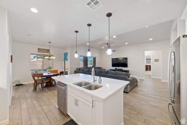 478 S Albano Way, St George, UT 84770 - kitchen featuring stainless steel appliances, a sink, open floor plan, light wood finished floors, and recessed lighting