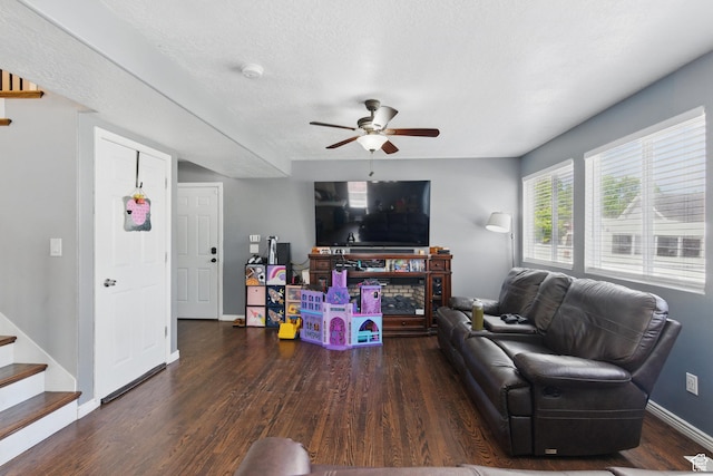 122 W Stern Ct Unit 25, Stansbury Park, UT 84074 - living room with wood finished floors, ceiling fan, baseboards, stairs, and a textured ceiling