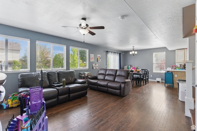 122 W Stern Ct Unit 25, Stansbury Park, UT 84074 - living room with ceiling fan, a chandelier, dark wood finished floors, baseboards, and a textured ceiling