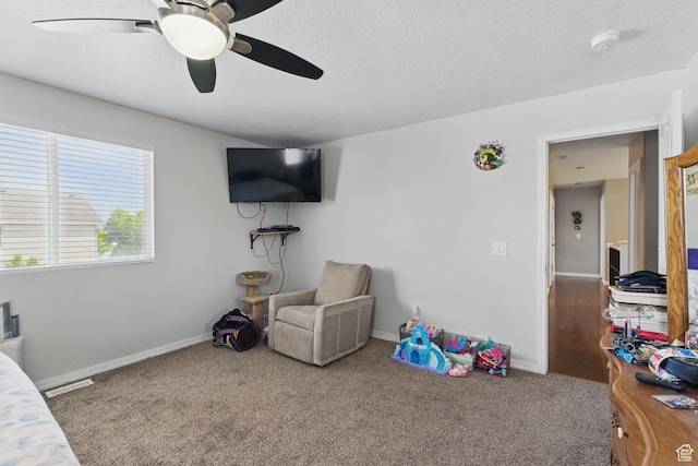 122 W Stern Ct Unit 25, Stansbury Park, UT 84074 - carpeted bedroom with baseboards, a ceiling fan, and a textured ceiling