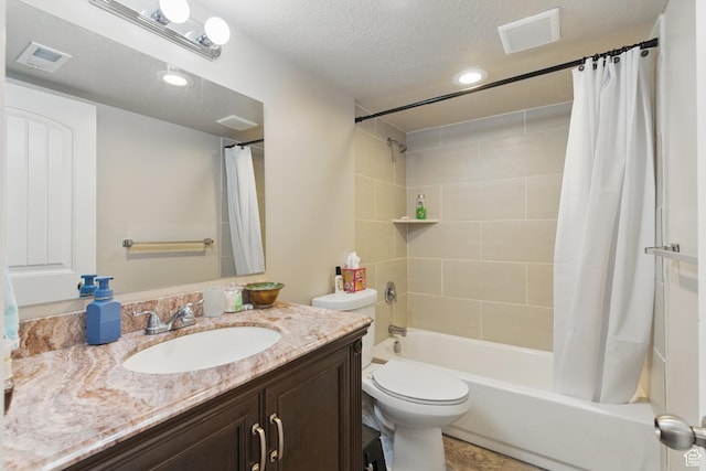 122 W Stern Ct Unit 25, Stansbury Park, UT 84074 - full bath with vanity, shower / bath combo, toilet, recessed lighting, and a textured ceiling