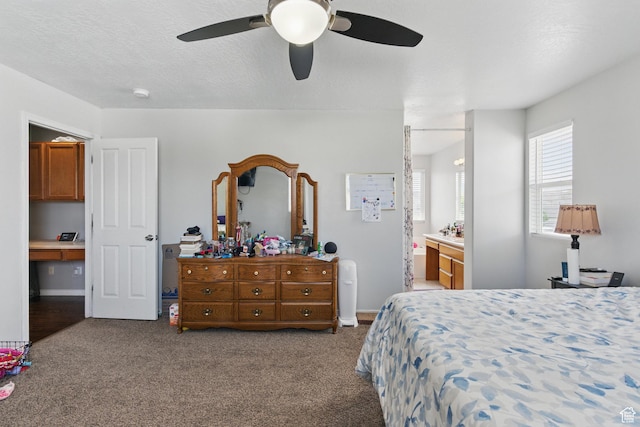 122 W Stern Ct Unit 25, Stansbury Park, UT 84074 - carpeted bedroom featuring ceiling fan and ensuite bath