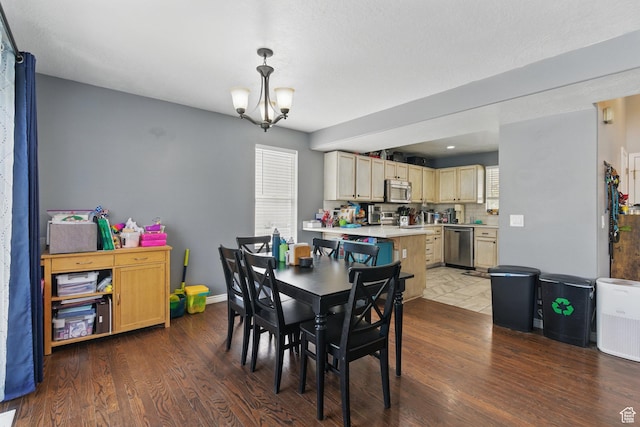 122 W Stern Ct Unit 25, Stansbury Park, UT 84074 - dining area with wood finished floors, baseboards, and a chandelier