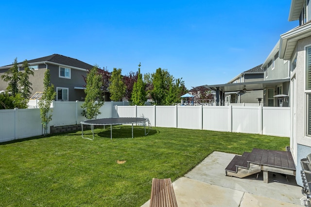 10966 S Coastal Dune Dr, South Jordan, UT 84009 - view of yard with ceiling fan, a trampoline, and a patio area