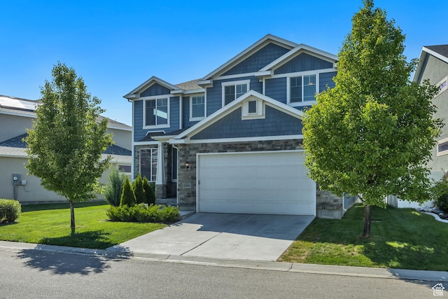 10966 S Coastal Dune Dr, South Jordan, UT 84009 - craftsman house featuring stone siding, concrete driveway, a front lawn, and board and batten siding