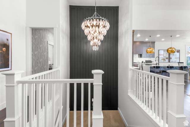 2041 W Pinnacle Ave, Mapleton, UT 84664 - hallway featuring an upstairs landing, a chandelier, and baseboards