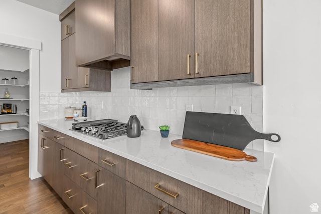2041 W Pinnacle Ave, Mapleton, UT 84664 - kitchen with wood finished floors, decorative backsplash, light countertops, and stainless steel gas stovetop