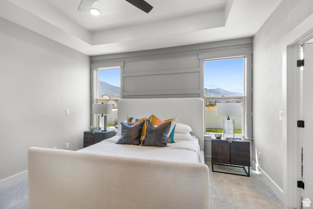 2041 W Pinnacle Ave, Mapleton, UT 84664 - carpeted bedroom with baseboards, a raised ceiling, a mountain view, and a ceiling fan