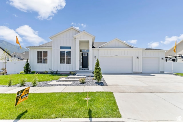 2041 W Pinnacle Ave, Mapleton, UT 84664 - modern farmhouse style home featuring board and batten siding, an attached garage, concrete driveway, and roof with shingles