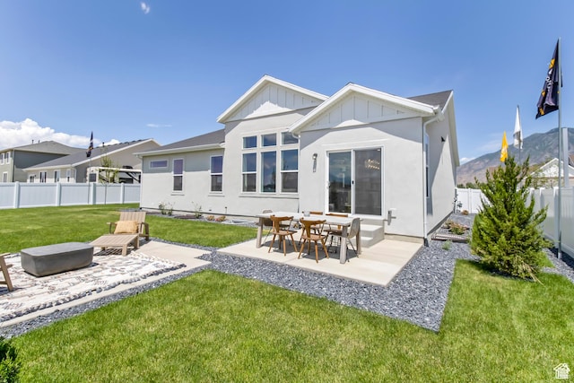 2041 W Pinnacle Ave, Mapleton, UT 84664 - rear view of property featuring a patio, board and batten siding, and stucco siding