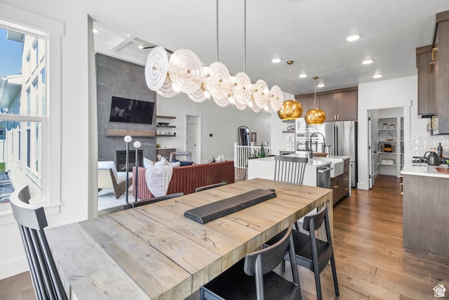 2041 W Pinnacle Ave, Mapleton, UT 84664 - dining room with dark wood finished floors, recessed lighting, and a fireplace