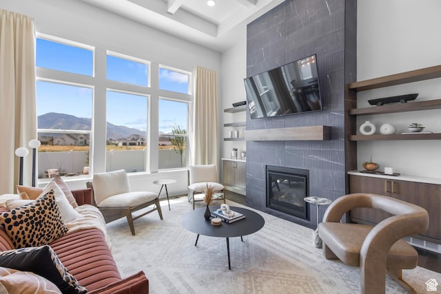 2041 W Pinnacle Ave, Mapleton, UT 84664 - living area featuring a towering ceiling, a tile fireplace, beamed ceiling, and recessed lighting