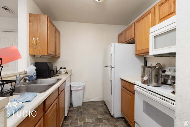 98 W 1230 N Unit 226, Provo, UT 84604 - kitchen featuring white appliances, a sink, light countertops, and stone finish floors