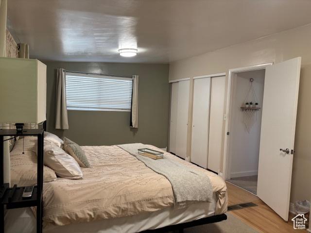 495 E 34 S Unit 10, Orem, UT 84097 - bedroom featuring two closets and wood finished floors