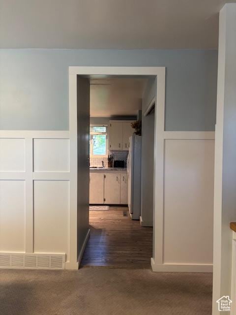 495 E 34 S Unit 10, Orem, UT 84097 - hall featuring a decorative wall, a wainscoted wall, and carpet floors