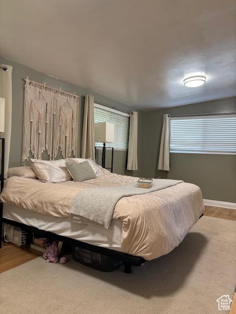 495 E 34 S Unit 10, Orem, UT 84097 - bedroom featuring wood finished floors and baseboards