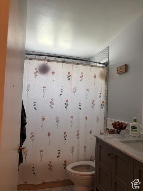 495 E 34 S Unit 10, Orem, UT 84097 - full bath with toilet, vanity, a shower with curtain, and tile patterned flooring