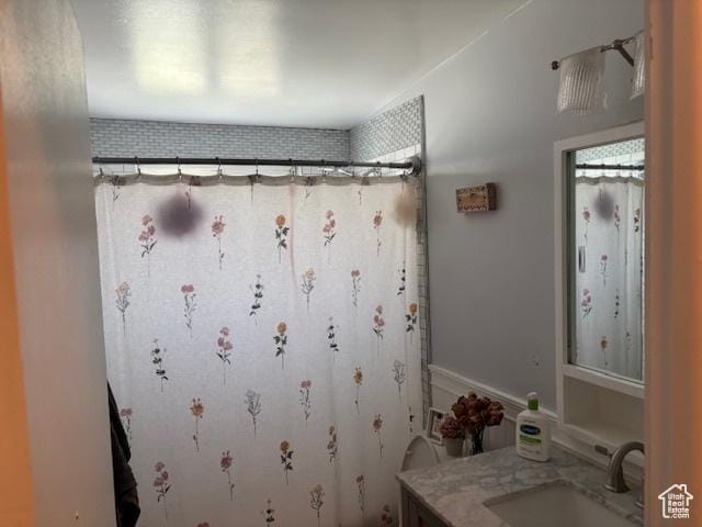 495 E 34 S Unit 10, Orem, UT 84097 - full bathroom featuring vanity and a shower with shower curtain