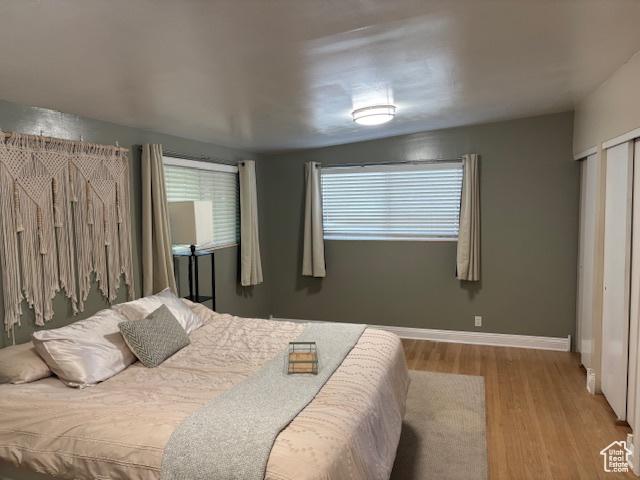 495 E 34 S Unit 10, Orem, UT 84097 - bedroom featuring wood finished floors and baseboards