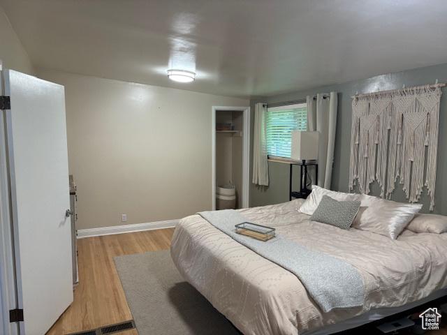 495 E 34 S Unit 10, Orem, UT 84097 - bedroom featuring light wood-type flooring, baseboards, and a closet