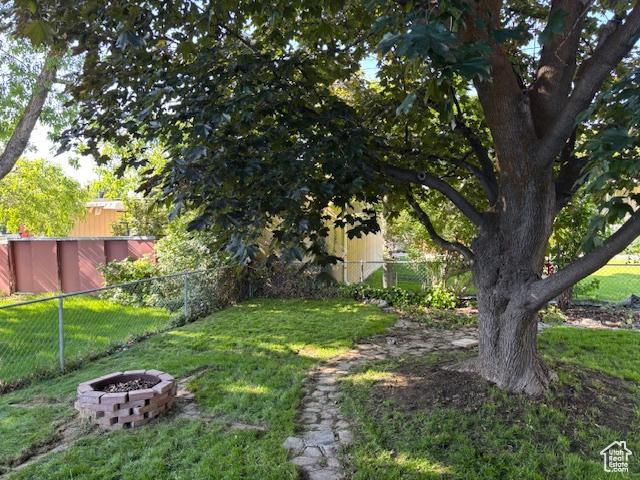495 E 34 S Unit 10, Orem, UT 84097 - view of yard featuring a fire pit