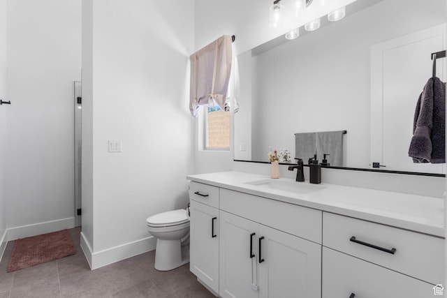 423 W Fitness Way, Ivins, UT 84738 - bathroom featuring vanity, baseboards, toilet, and tile patterned floors