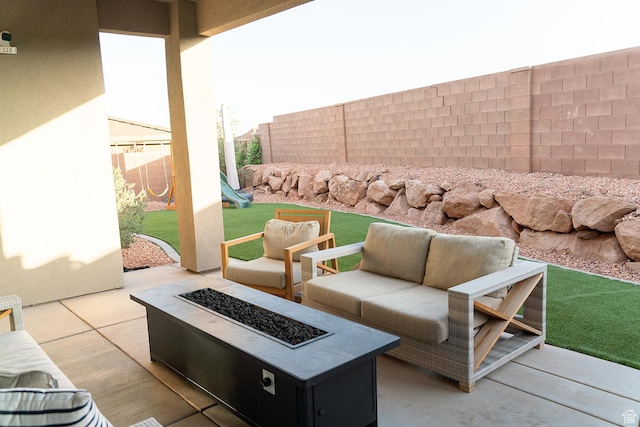 423 W Fitness Way, Ivins, UT 84738 - fenced backyard featuring a patio, an outdoor living space with a fire pit, and a playground