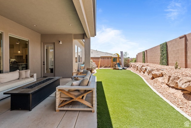 423 W Fitness Way, Ivins, UT 84738 - fenced backyard featuring an outdoor living space with a fire pit, a playground, and a patio