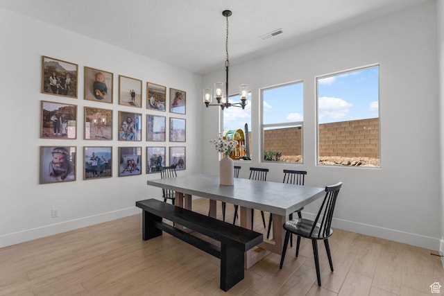 423 W Fitness Way, Ivins, UT 84738 - dining room with a chandelier, baseboards, and light wood-style floors