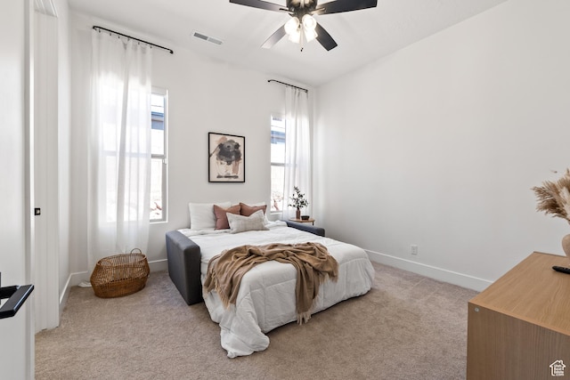 423 W Fitness Way, Ivins, UT 84738 - bedroom featuring light carpet, multiple windows, and ceiling fan