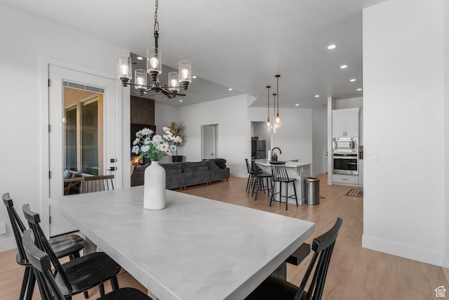 423 W Fitness Way, Ivins, UT 84738 - dining space featuring a chandelier, light wood-style floors, recessed lighting, and baseboards