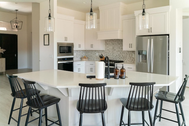 423 W Fitness Way, Ivins, UT 84738 - kitchen with appliances with stainless steel finishes, decorative backsplash, light countertops, and white cabinets