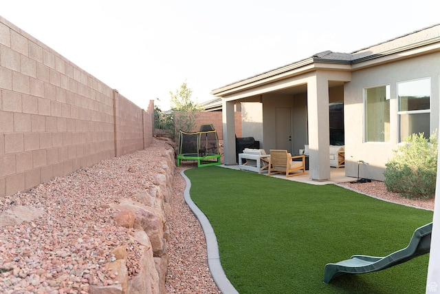 423 W Fitness Way, Ivins, UT 84738 - view of yard with a trampoline, an outdoor living space, and a patio area