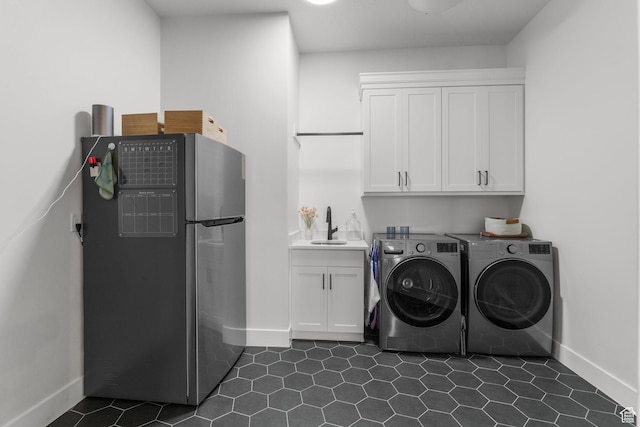 423 W Fitness Way, Ivins, UT 84738 - laundry area with cabinet space, baseboards, washing machine and dryer, and dark tile patterned flooring