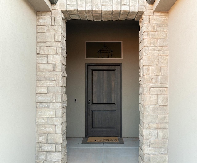 423 W Fitness Way, Ivins, UT 84738 - doorway to property with stucco siding and stone siding