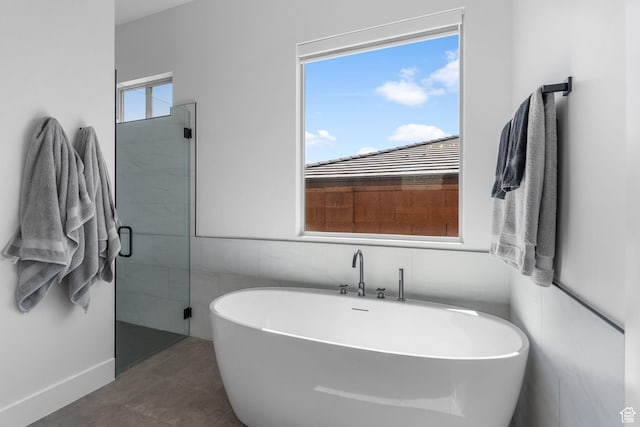 423 W Fitness Way, Ivins, UT 84738 - bathroom with a soaking tub, a shower stall, and tile patterned floors