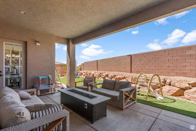423 W Fitness Way, Ivins, UT 84738 - fenced backyard featuring a patio and an outdoor living space with a fire pit