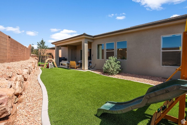 423 W Fitness Way, Ivins, UT 84738 - rear view of house featuring stucco siding and a patio area