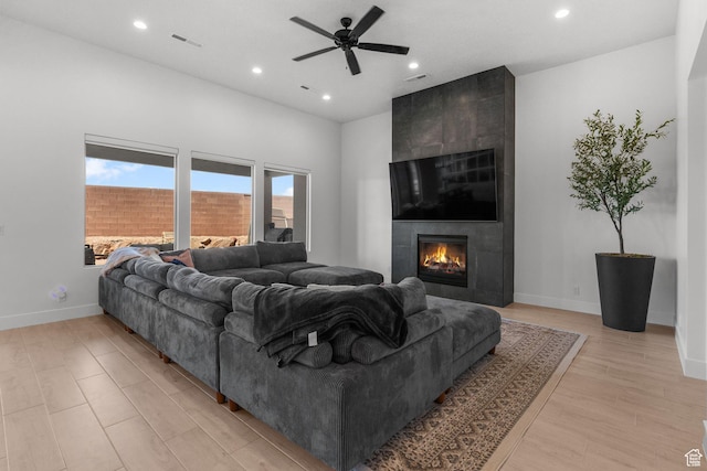 423 W Fitness Way, Ivins, UT 84738 - living room featuring ceiling fan, a tiled fireplace, recessed lighting, baseboards, and light wood finished floors